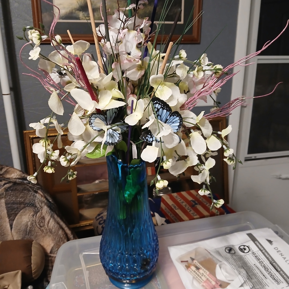 Elegant Blue Vase with White Floral Arrangement